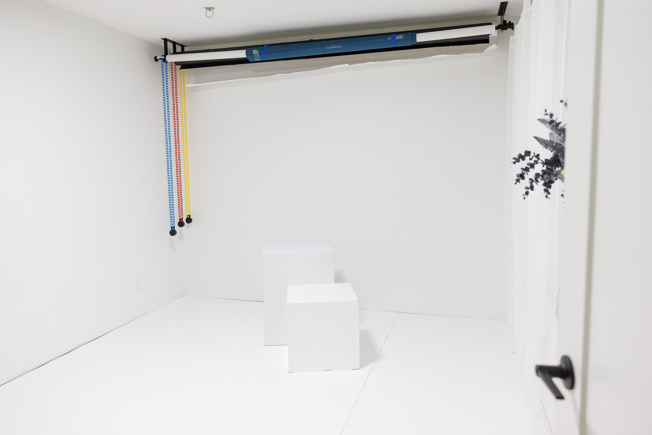 La Quinta home photography studio with white backdrop and studio props